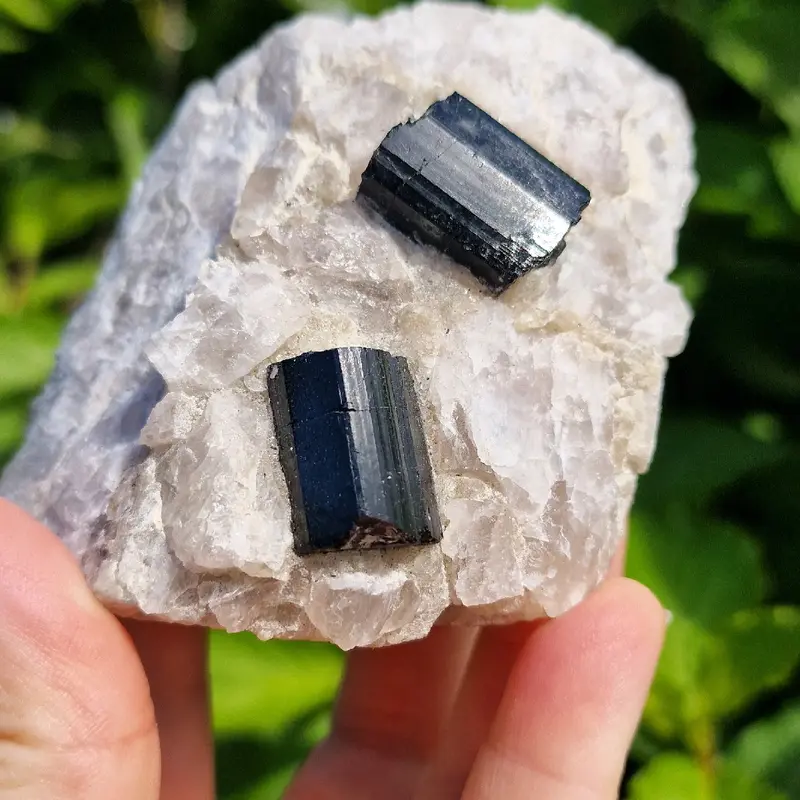 Raw black tourmaline in a chunk of raw quartz 3