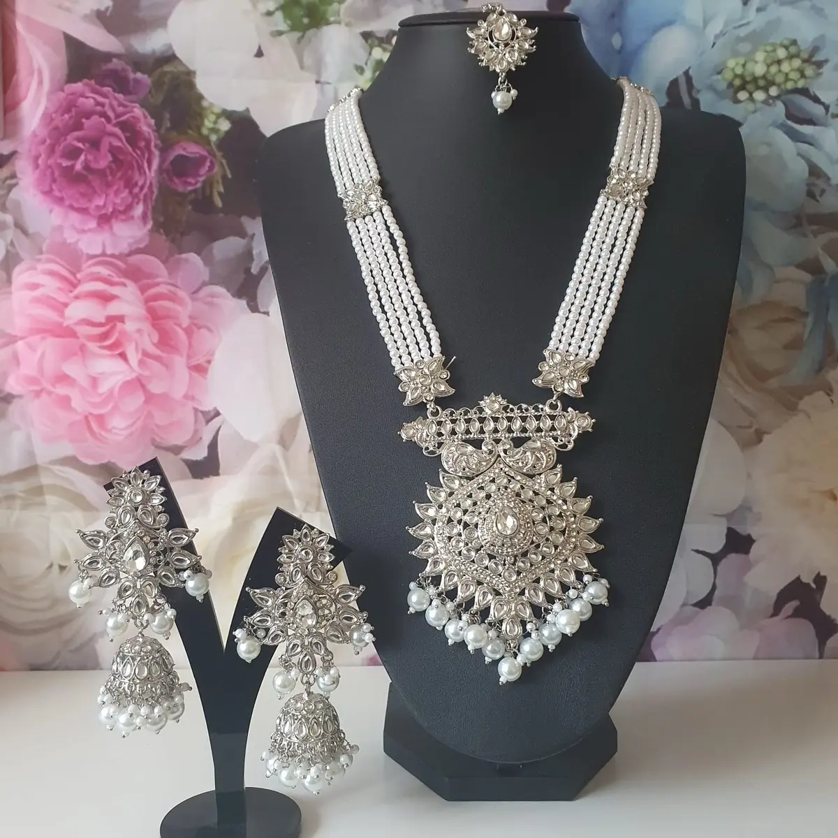 Pearls long mala comes with earrings and tikka