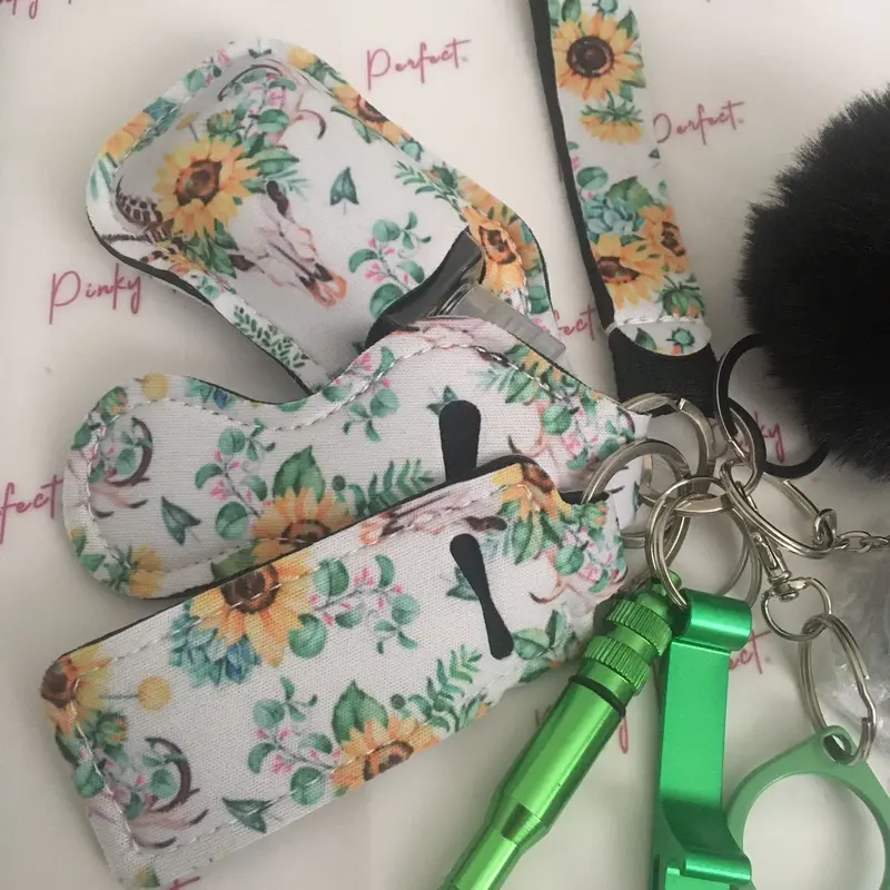 Pinky Perfect UK Legal Green Sunflower Key Chain Set with 3-in-1 Stylus, Door Opener, Bottle Opener, Whistle, Personal Alarm, Light, Wristlet, Sanitiser Pouch, Bottle, Lip Balm Holder, Pom Pom and Car Escape Tool 1