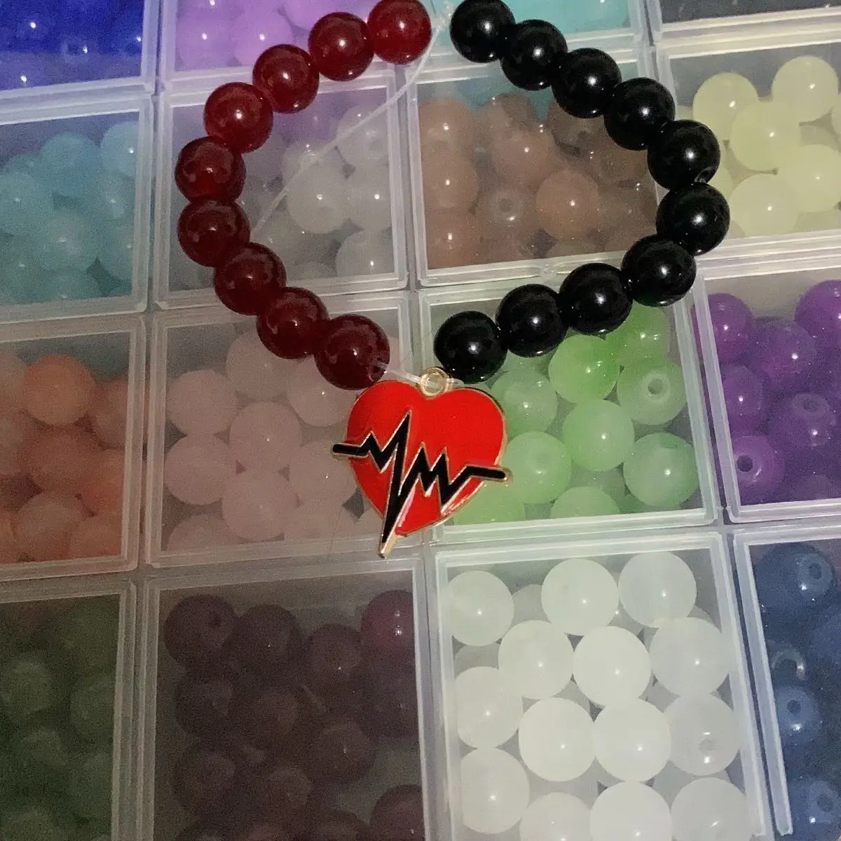 Red and black heart rate bracelet charm