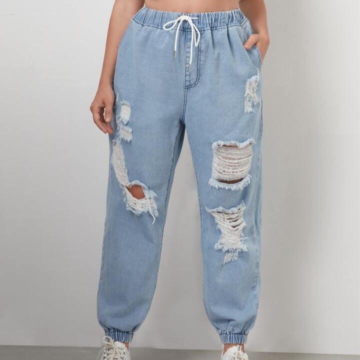 Light blue ripped jeans with elastic waist and drawstring featuring a baggy fit #Rippedjeans 3