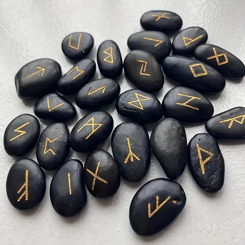 A Set of 25 Natural Black Pebbles Engraved with Ancient Letters, Accompanied by a Bag 0