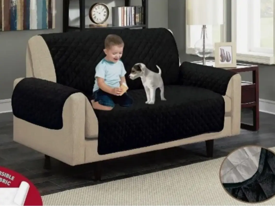 Quilted water repellent black / grey reversible sofa protector for 2 or 3 seater