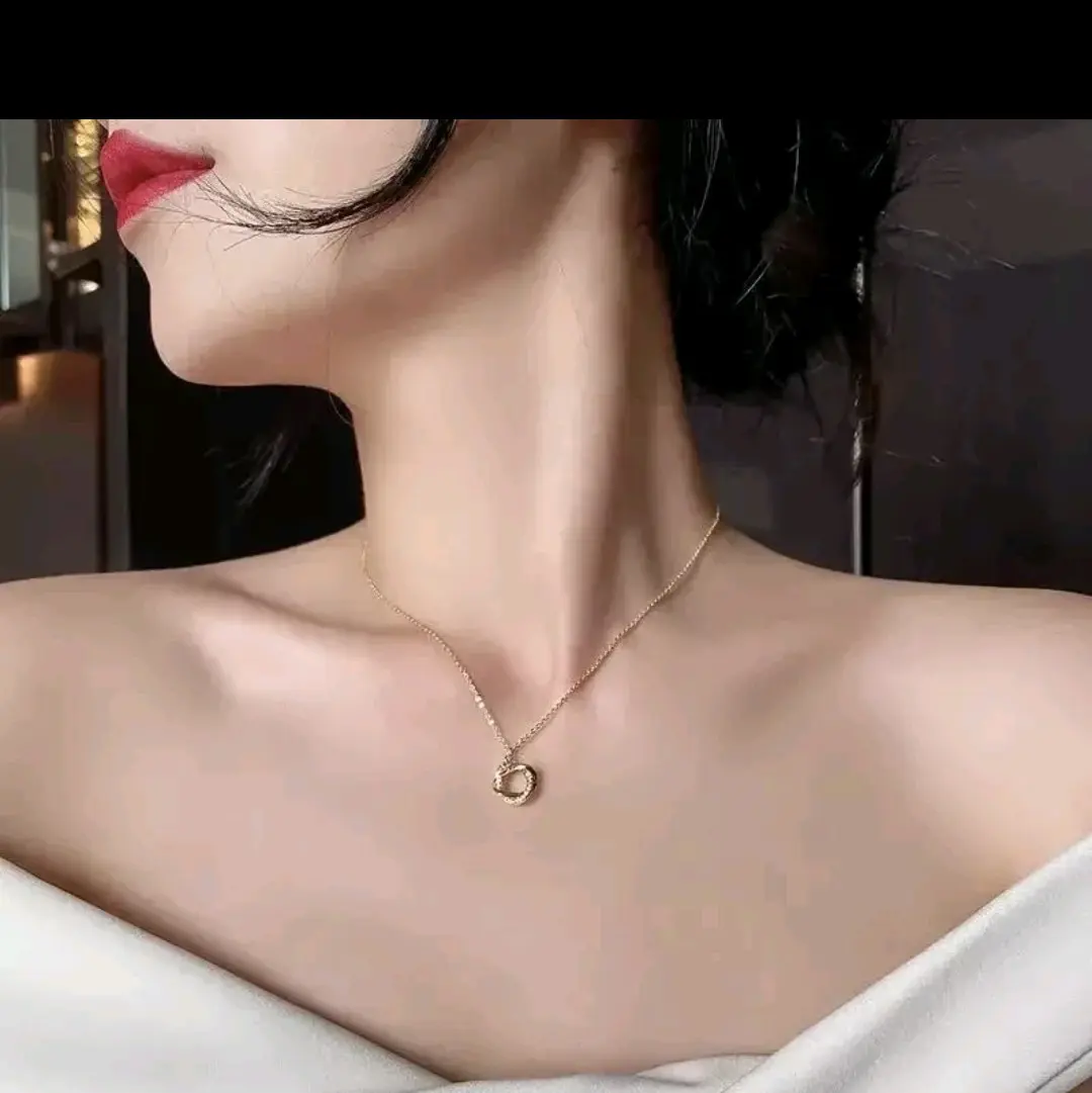 Golden Necklace With A Rimstone Pendant
