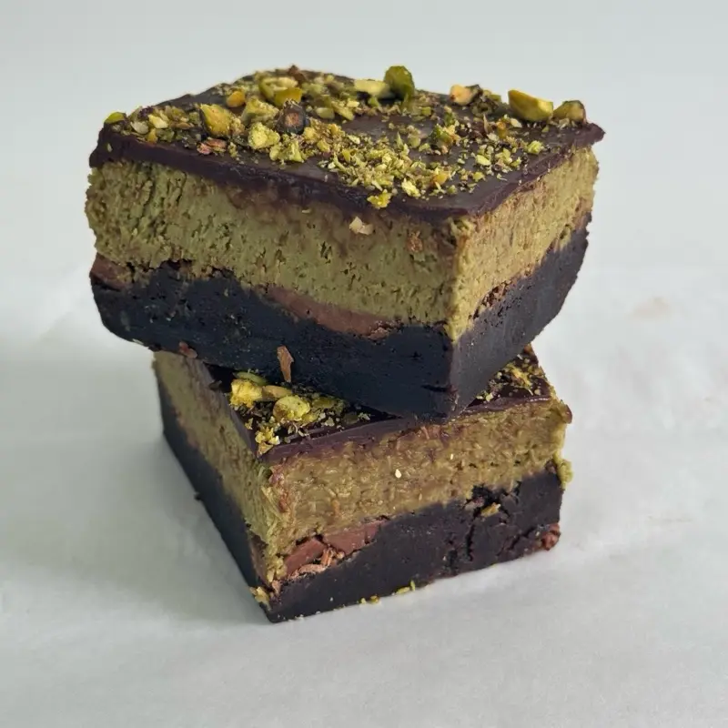 Pistachio Knafeh Brownie slice x2, topped with chocolate. Dubai Chocolate inspired!