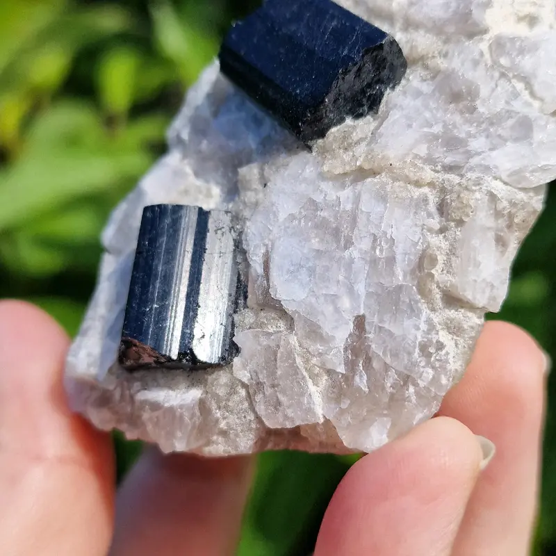 Raw black tourmaline in a chunk of raw quartz 1