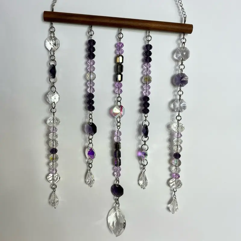 Beautiful, handmade sun catcher can be hung indoors or outside. Made with driftwood, stainless steel metal and glass beads, approx. 11cm W x 20cm L various colours