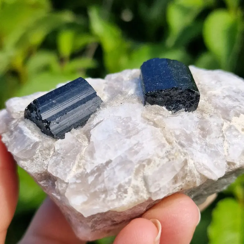 Raw black tourmaline in a chunk of raw quartz 2