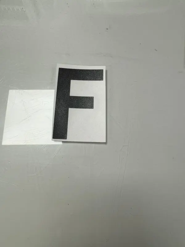 Anti Flash letters designed to disappear when exposed to camera flash 1