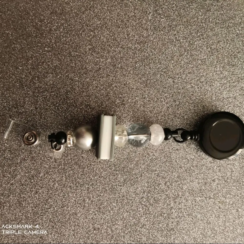 Hand made retractable landyard/badge holder