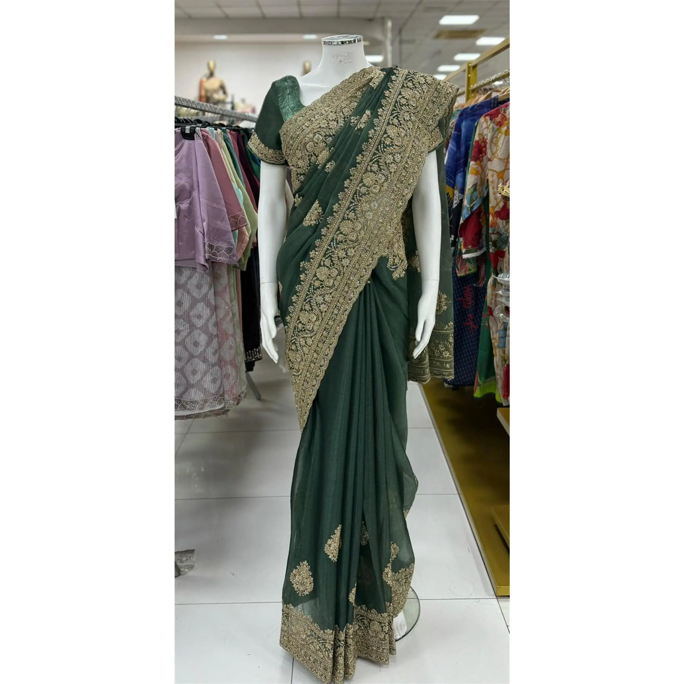 BS-LA-SA-1393 - Jimmy cho saree with kasab,dory and stone works heavy embroidary border.It comes with readymade shor