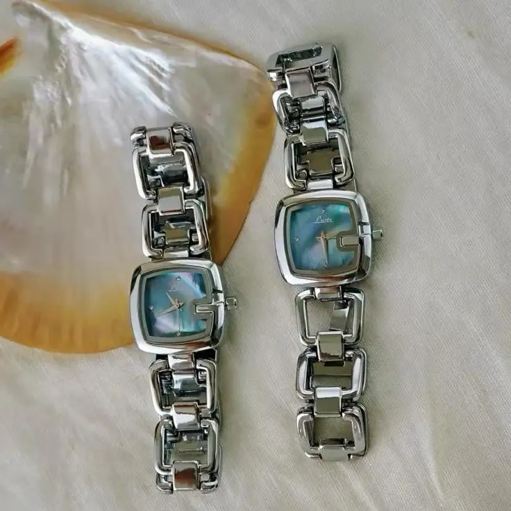 Women's Elegant Luxury Quartz Watch with Stainless Steel Band and Rhinestone & Mother Of Pearl Dial - Hollow Design