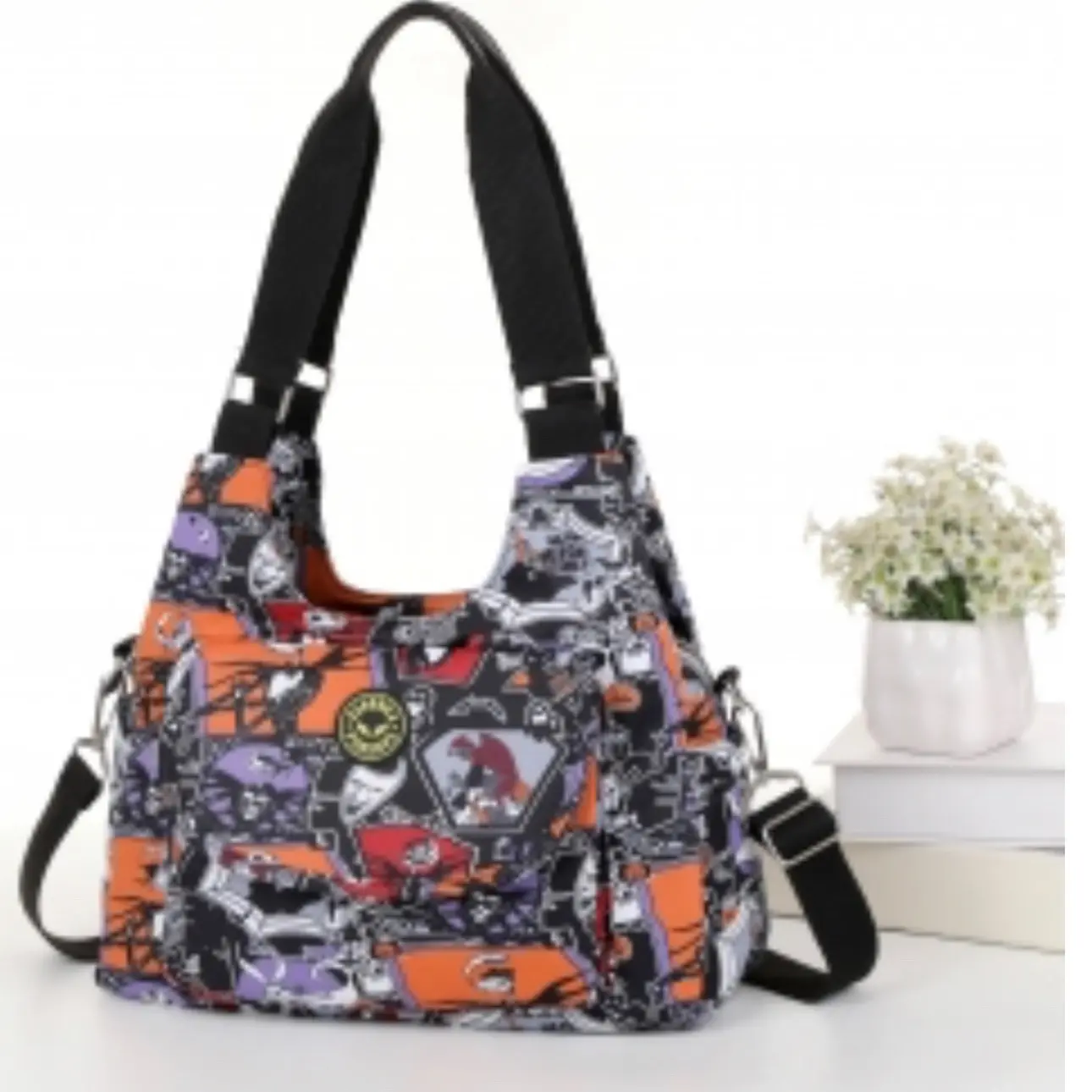 Nightmare shoulder bag with black straps