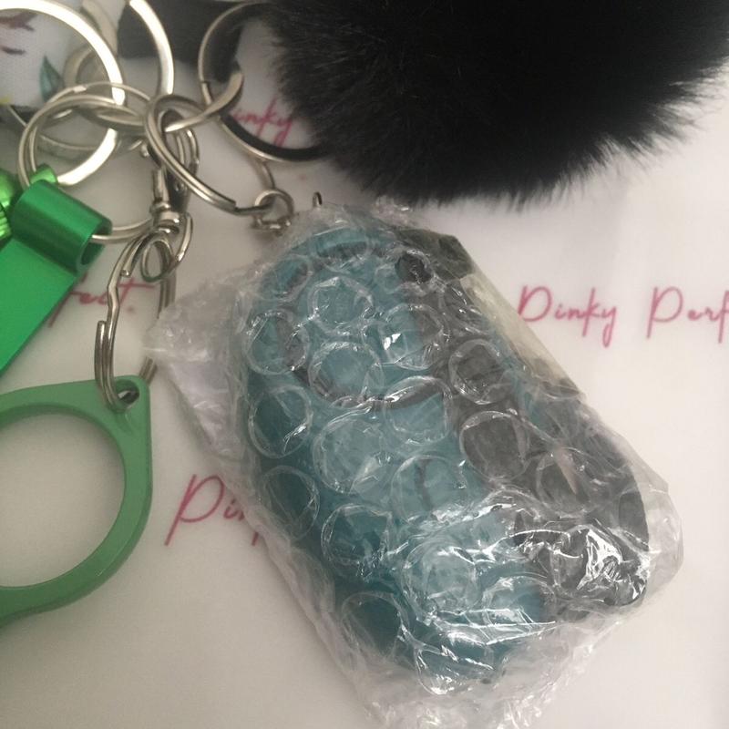 Pinky Perfect UK Legal Green Sunflower Key Chain Set with 3-in-1 Stylus, Door Opener, Bottle Opener, Whistle, Personal Alarm, Light, Wristlet, Sanitiser Pouch, Bottle, Lip Balm Holder, Pom Pom and Car Escape Tool 5