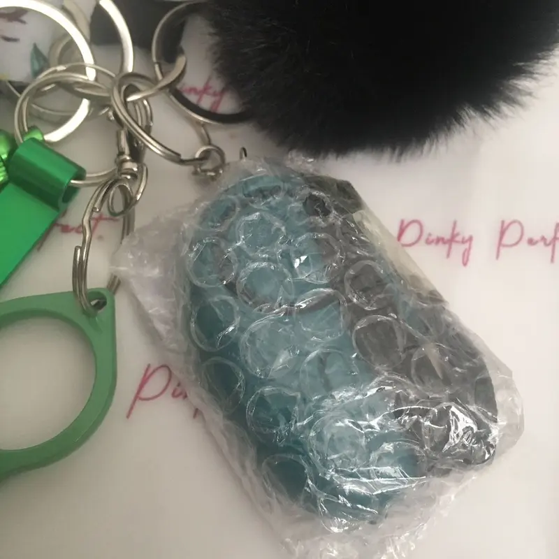Pinky Perfect UK Legal Green Sunflower Key Chain Set with 3-in-1 Stylus, Door Opener, Bottle Opener, Whistle, Personal Alarm, Light, Wristlet, Sanitiser Pouch, Bottle, Lip Balm Holder, Pom Pom and Car Escape Tool 5