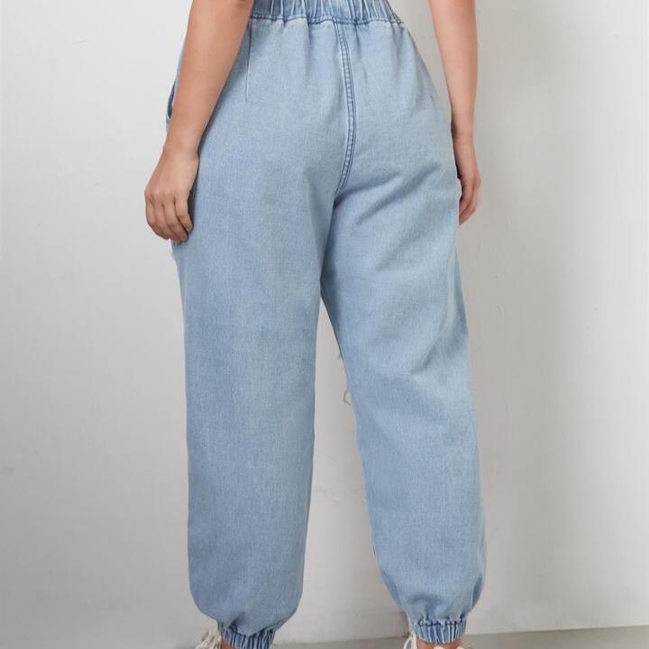 Light blue ripped jeans with elastic waist and drawstring featuring a baggy fit #Rippedjeans 1
