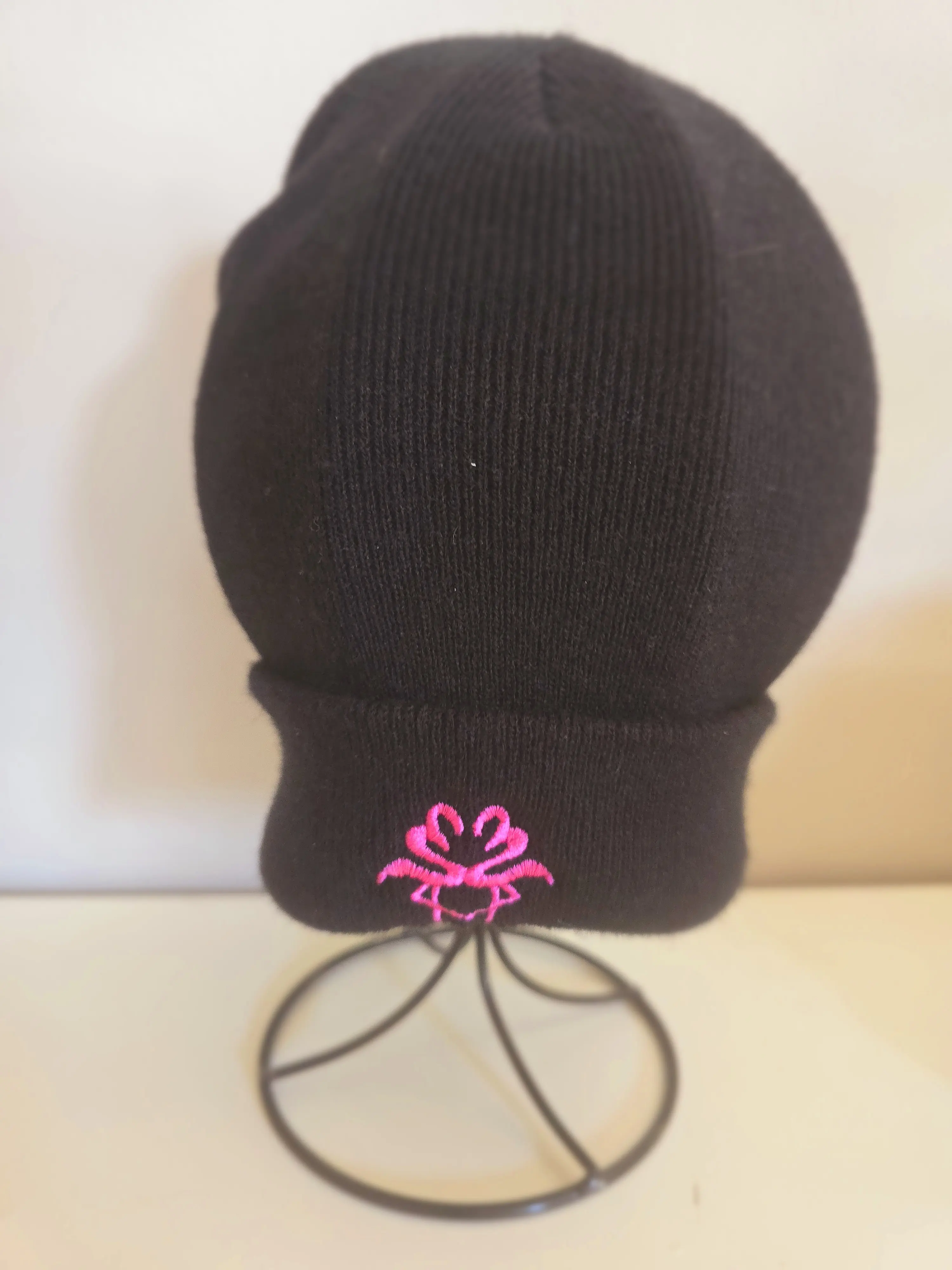 S2 flamingo logo health is wealth black beanie hat. Perfect in all weathers and as an accessory for any outfit.