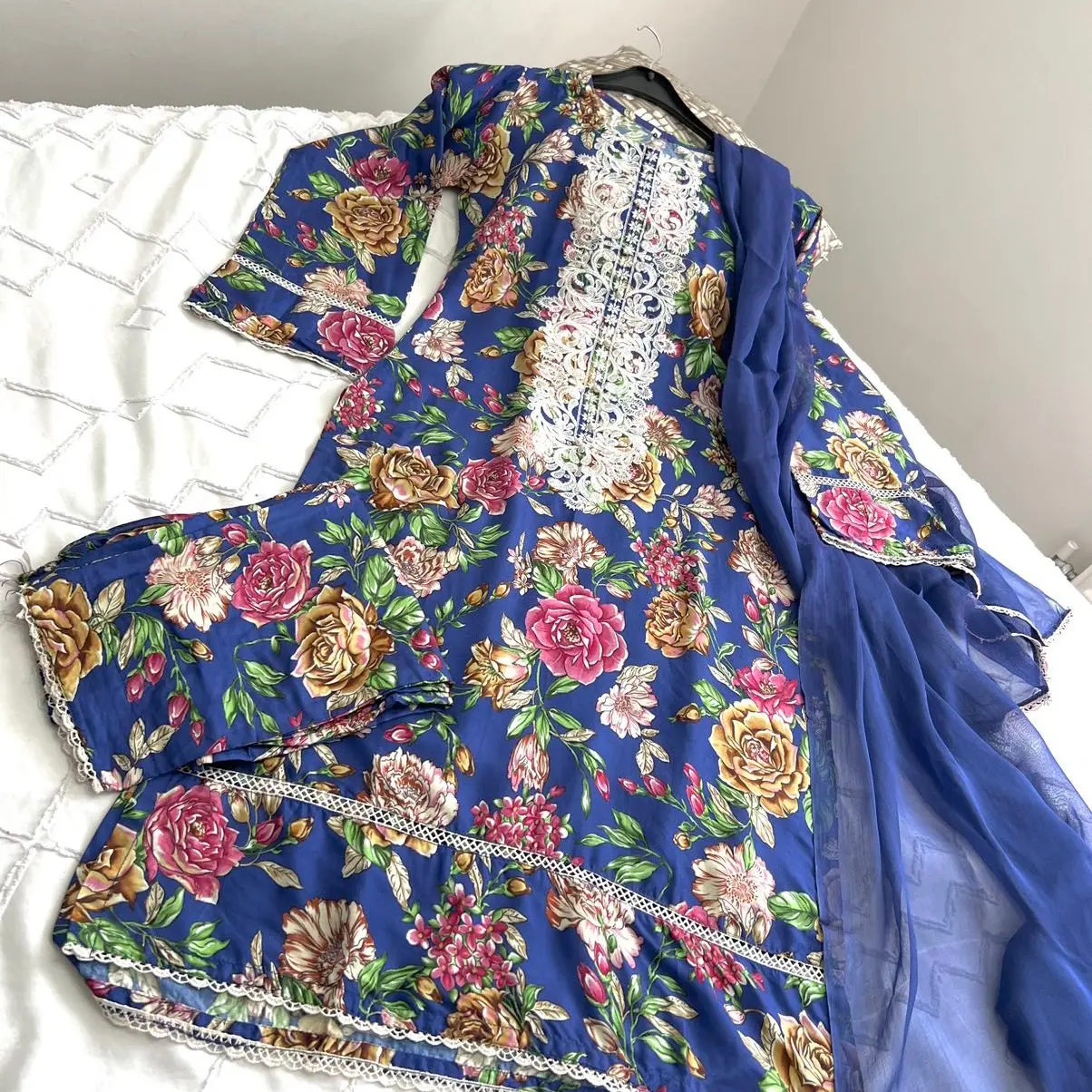 Floral print linen 3 piece with thread work on neckline with plain dupatta and floral trouser Comfortable Womenswear