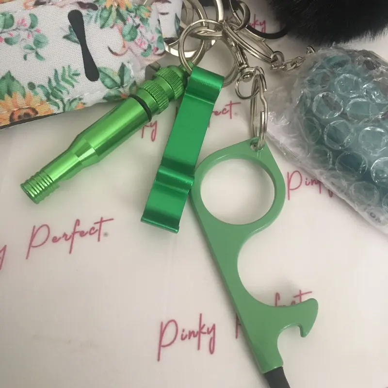 Pinky Perfect UK Legal Green Sunflower Key Chain Set with 3-in-1 Stylus, Door Opener, Bottle Opener, Whistle, Personal Alarm, Light, Wristlet, Sanitiser Pouch, Bottle, Lip Balm Holder, Pom Pom and Car Escape Tool 3